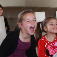 Children laughing during Jimmy Marvel's magic show